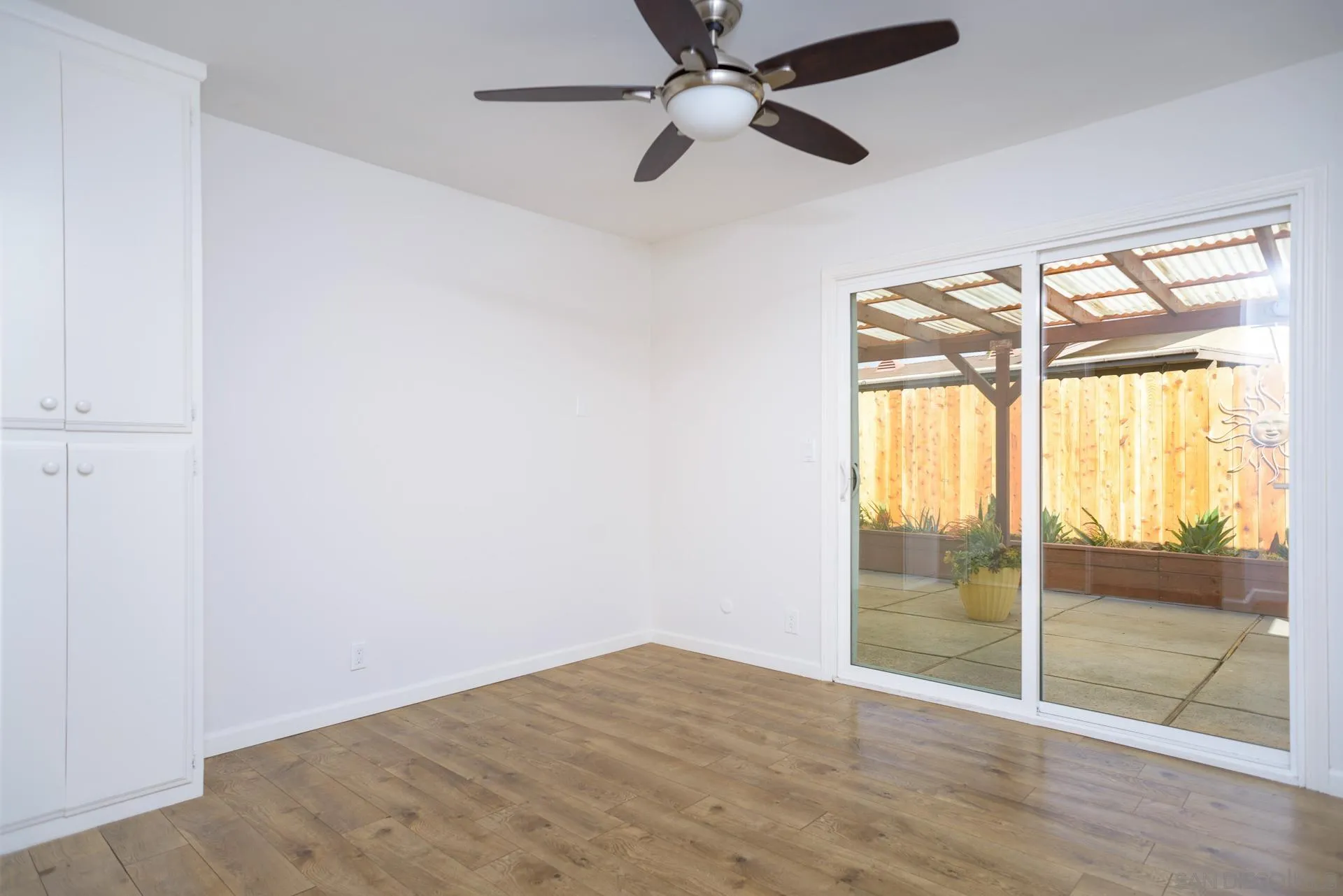 102 Magdalena Drive Oceanside, CA 92057 - Photo 27 of 48 wooden floor in an empty room with a window