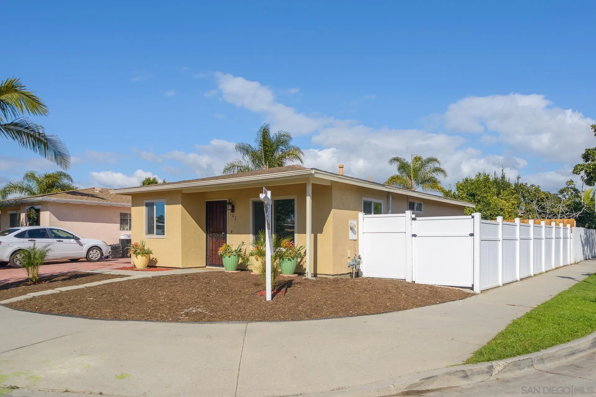 102 Magdalena Drive Oceanside, CA 92057 - Photo 3 of 48 a front view of a house with a yard and garage