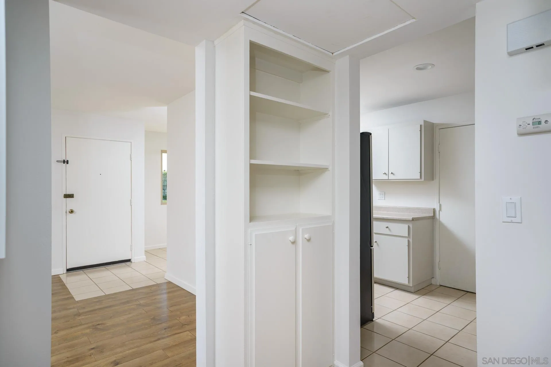 102 Magdalena Drive Oceanside, CA 92057 - Photo 31 of 48 a view of a kitchen from the hallway with a bathroom