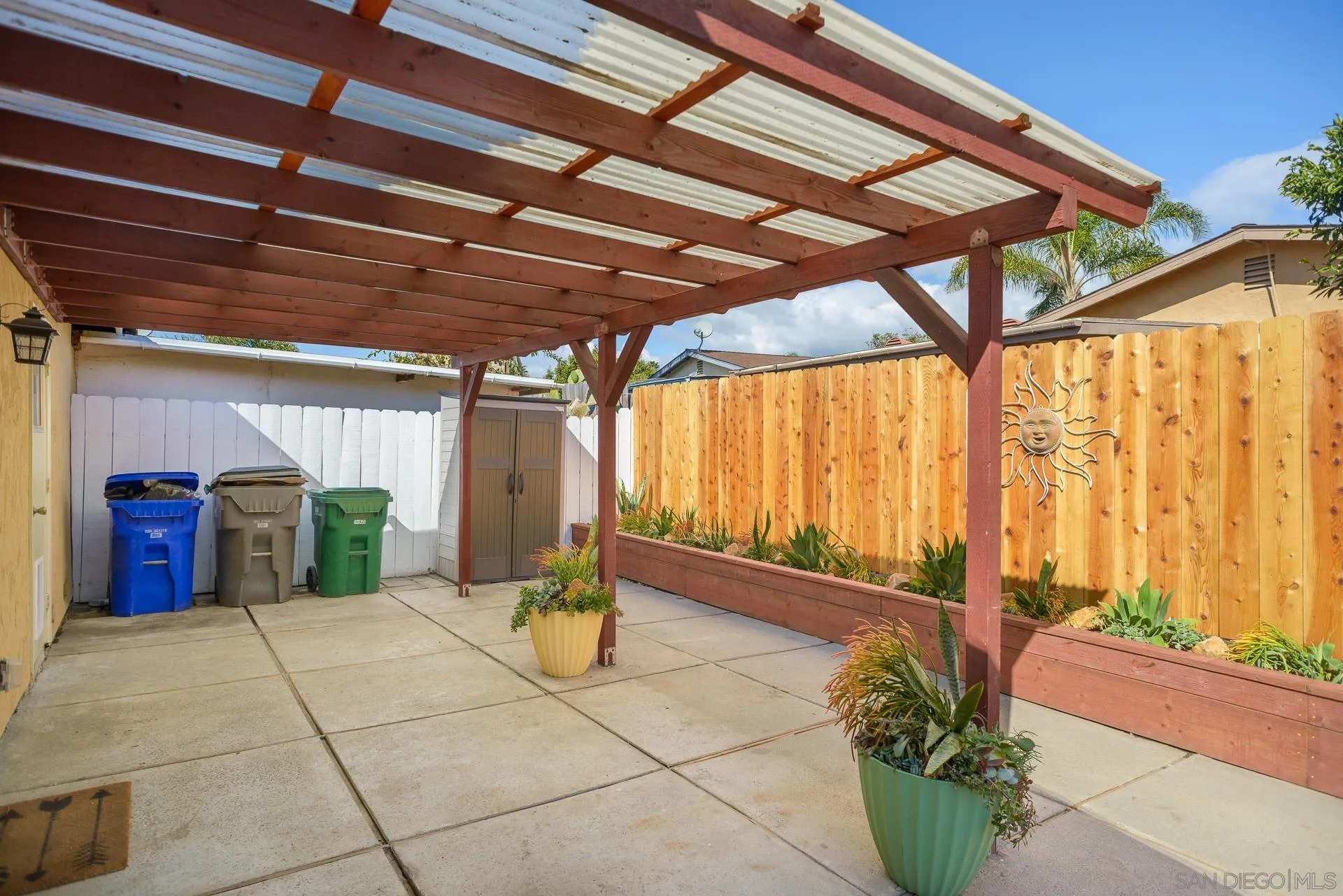 102 Magdalena Drive Oceanside, CA 92057 - Photo 45 of 48 a view of a patio with a table and chairs