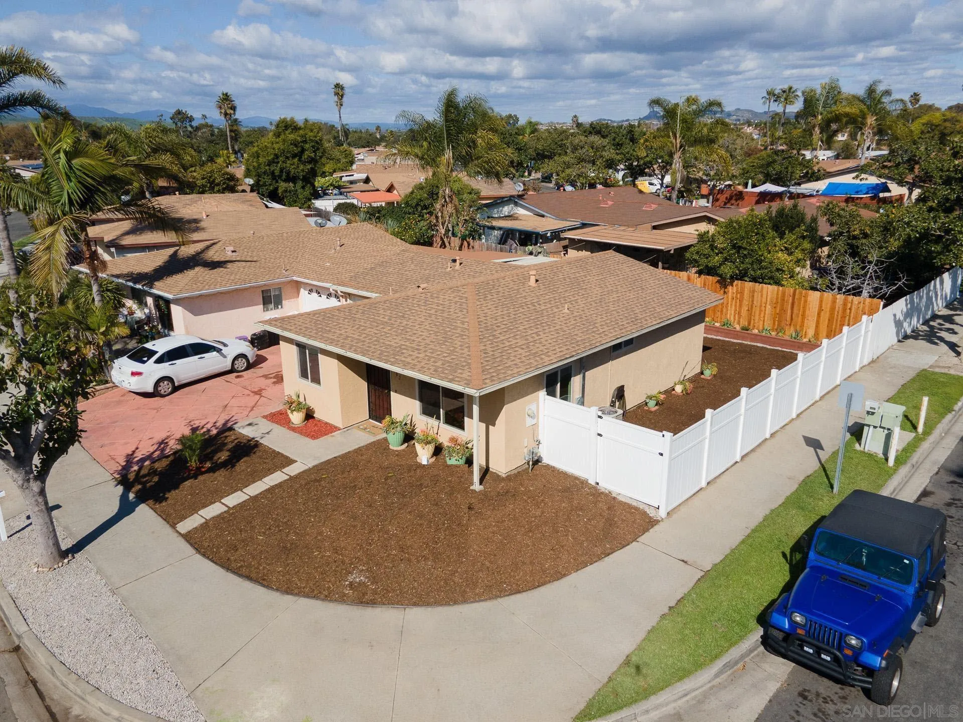 102 Magdalena Drive Oceanside, CA 92057 - Photo 9 of 48 an aerial view of a house with a swimming pool and mountains