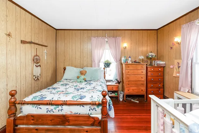 a bed room with a bed and a window