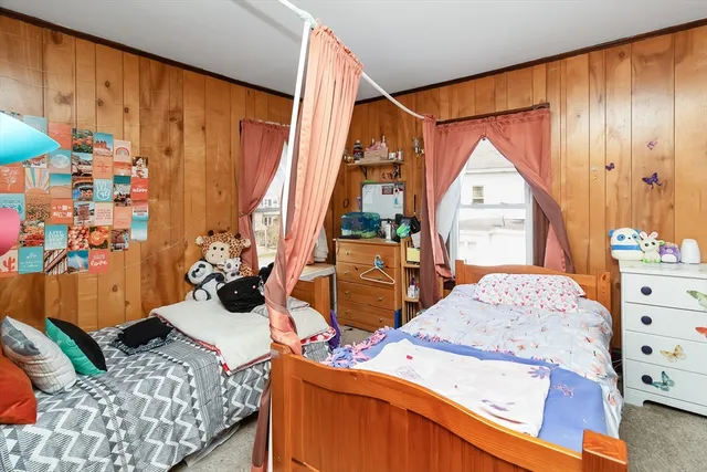 a view of bedroom with a bed and furniture