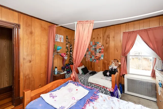 a bed room with a bed and a window