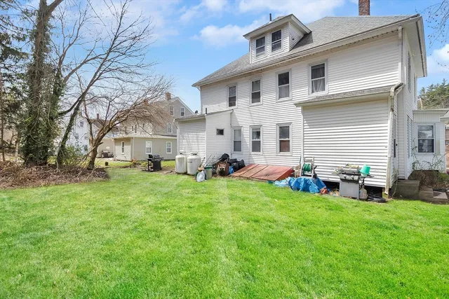 a view of a house with a backyard