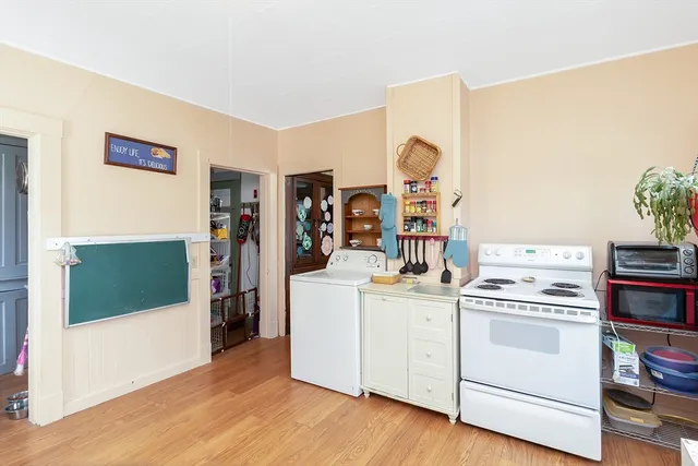a view of kitchen and wooden floor