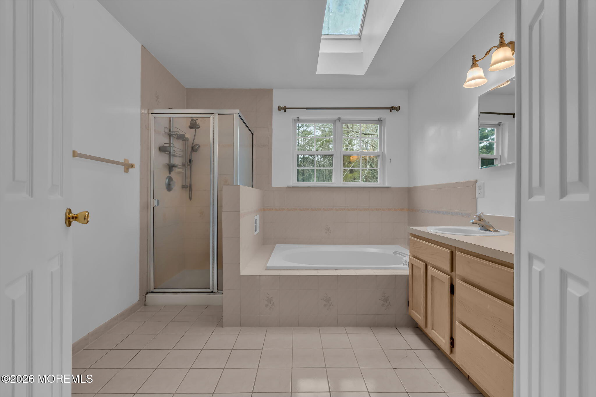 a bathroom with a bathtub and a shower