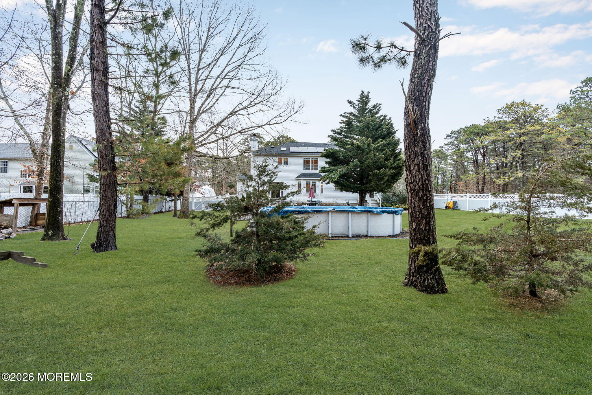 6 Candy Court Jackson, NJ 08527 - Photo 60 of 74 a view of a garden with a tree in the background
