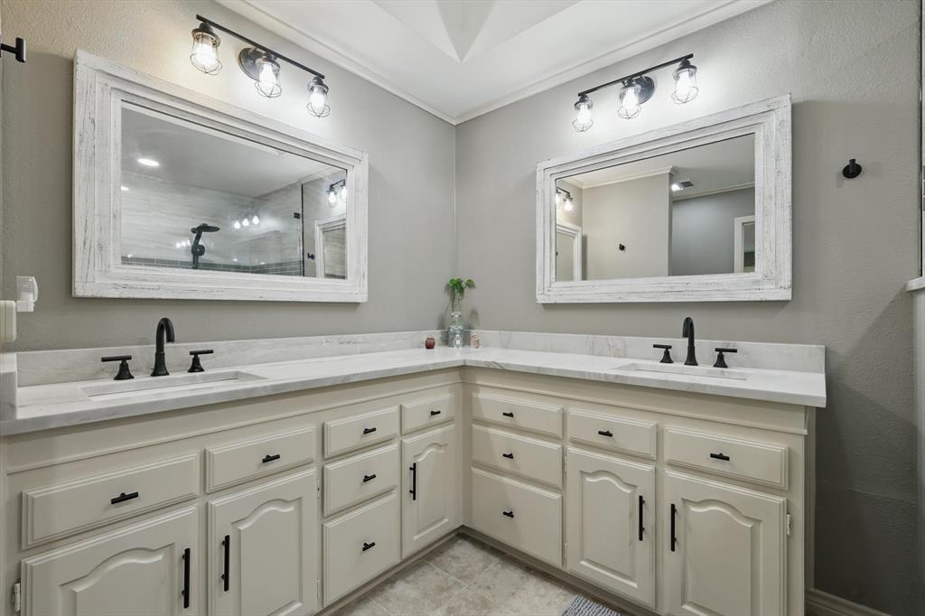 1904 Oak Ridge Trail Bridgeport, TX 76426 - Photo 19 of 34 Full bath with double vanity, a shower, and crown molding