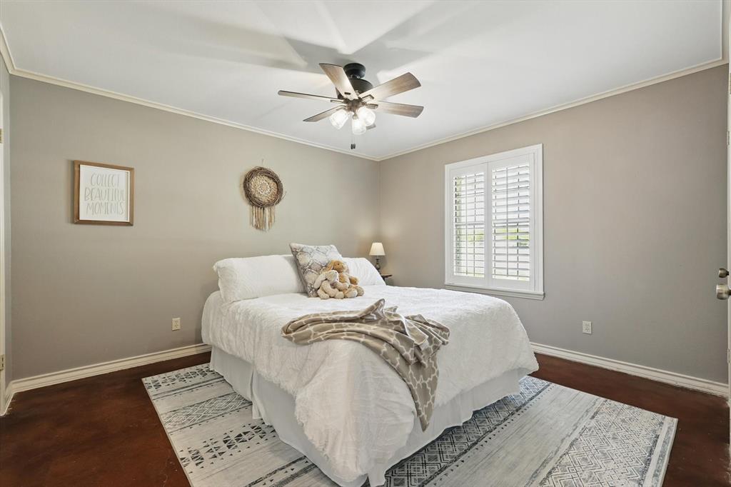 1904 Oak Ridge Trail Bridgeport, TX 76426 - Photo 23 of 34 Bedroom with crown molding and ceiling fan