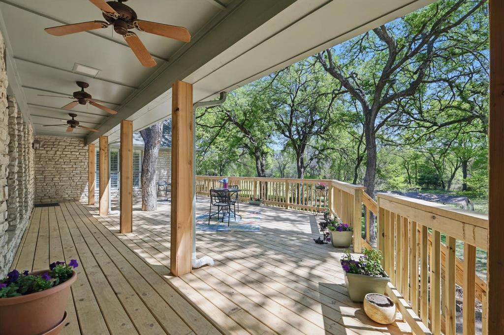 1904 Oak Ridge Trail Bridgeport, TX 76426 - Photo 28 of 34 Wooden deck with a ceiling fan