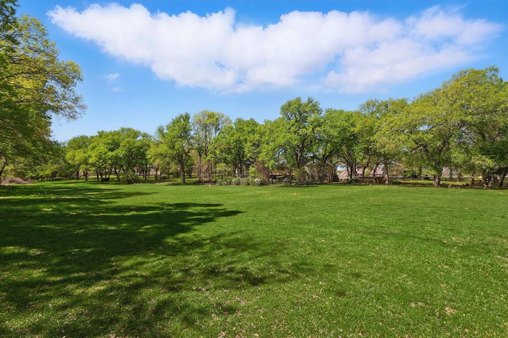 1904 Oak Ridge Trail Bridgeport, TX 76426 - Photo 32 of 34 View of green lawn with view of scattered trees