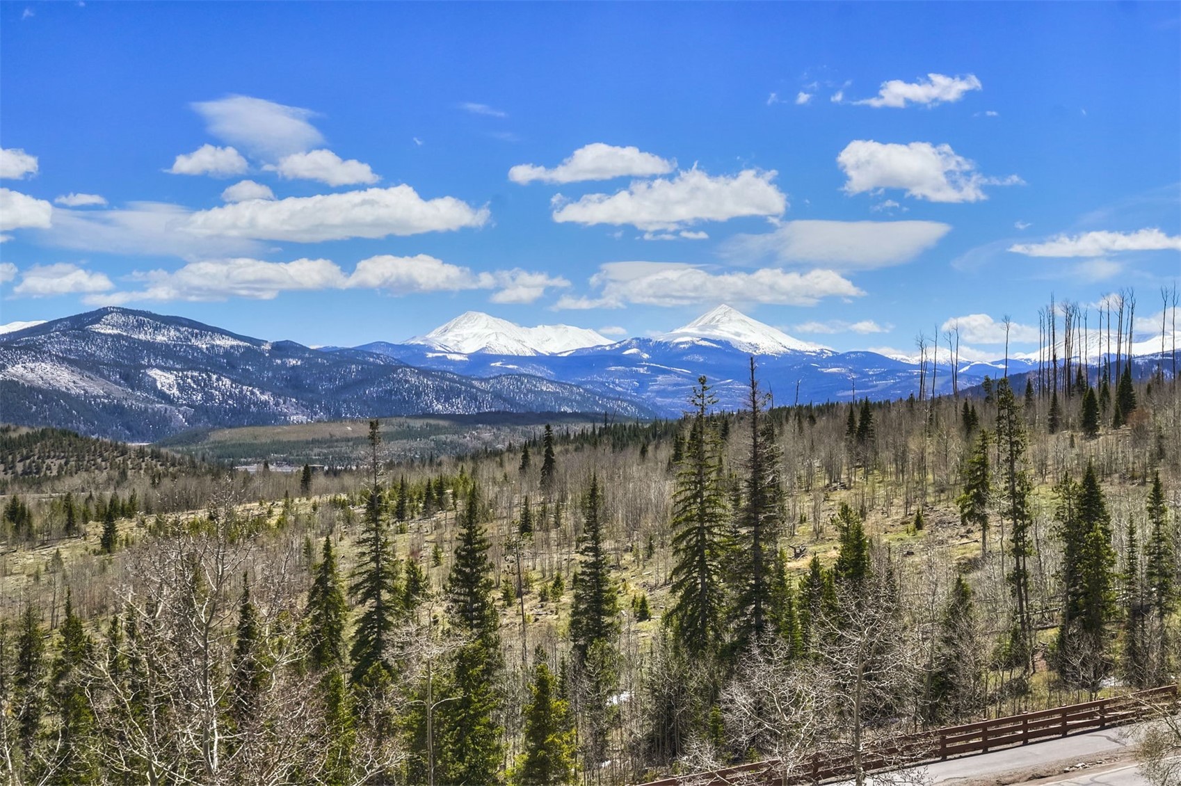 7031 Ryan Gulch Road, Unit 301 Silverthorne, CO 80498 - Photo 21 of 37 a view of a lake with a city