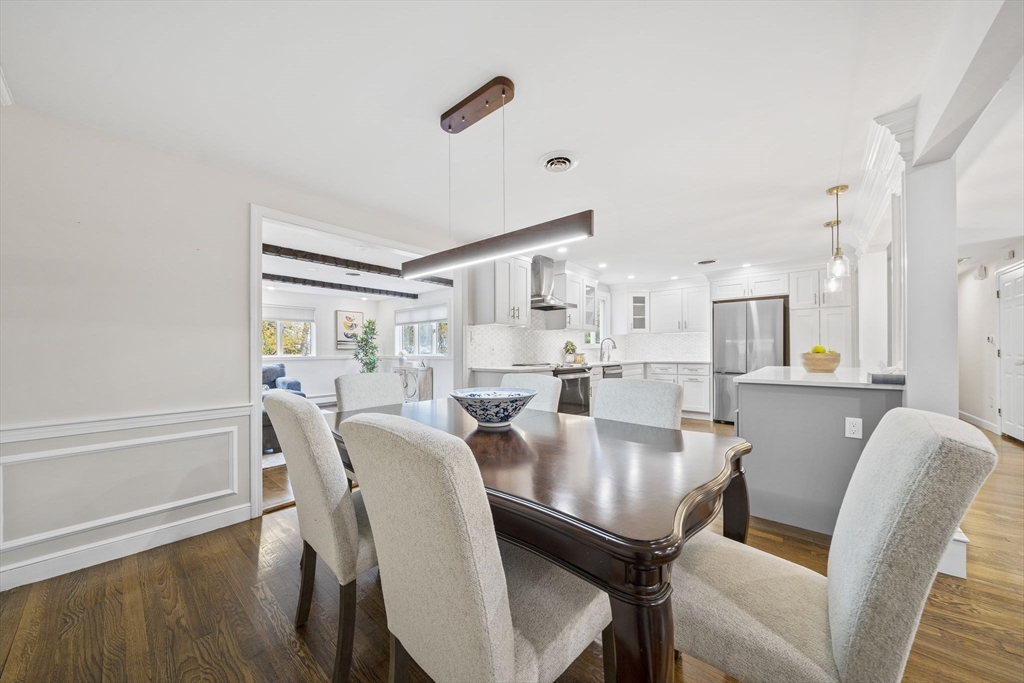 3 Burke Drive Canton, MA 02021 - Photo 15 of 39 a view of a dining room with furniture and wooden floor