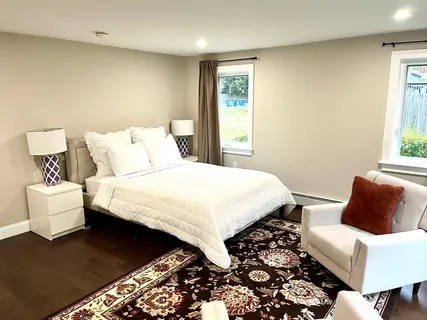 a bedroom with bed and a couch