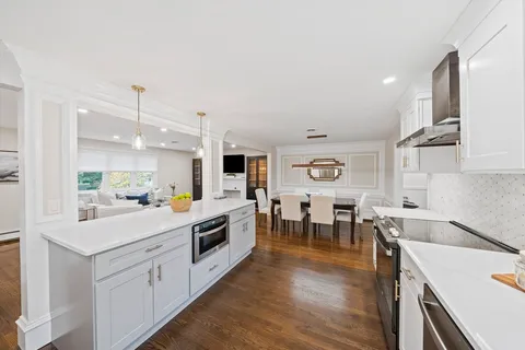 a large white kitchen with lots of counter top space