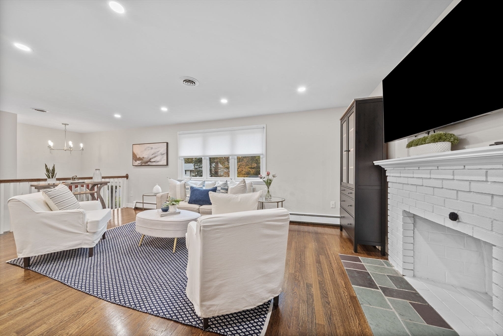 3 Burke Drive Canton, MA 02021 - Photo 10 of 39 a living room with furniture a flat screen tv and a rug