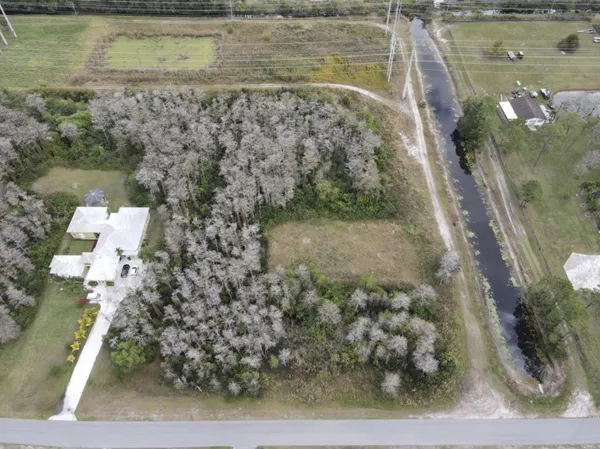 a aerial view of a house with a yard