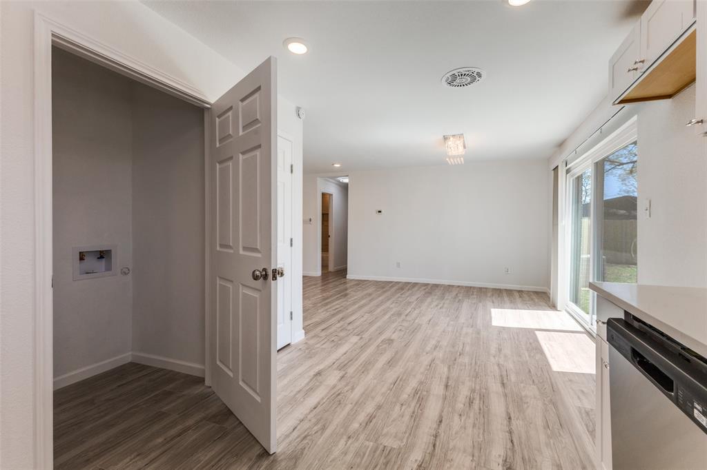 2950 Windmill Lane Farmers Branch, TX 75234 - Photo 13 of 25 a view of a hallway with wooden floor and staircase