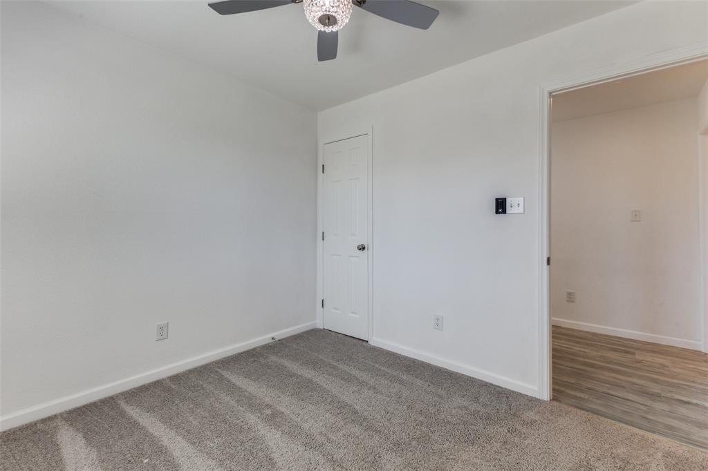 2950 Windmill Lane Farmers Branch, TX 75234 - Photo 15 of 25 an empty room with a empty space and a ceiling fan