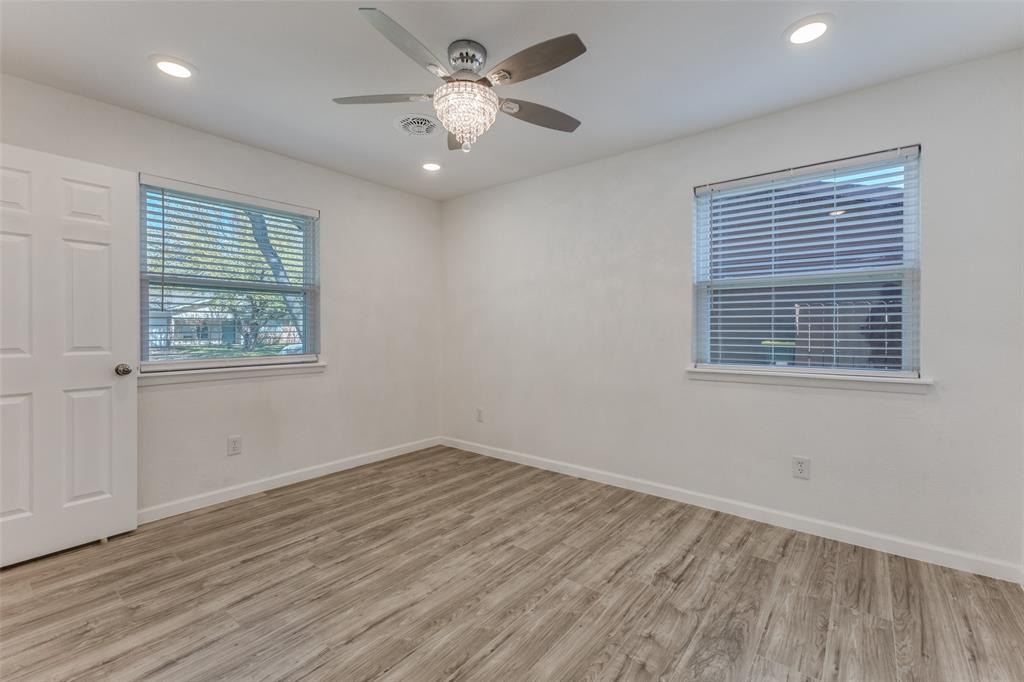 2950 Windmill Lane Farmers Branch, TX 75234 - Photo 18 of 25 a view of an empty room with wooden floor and a window