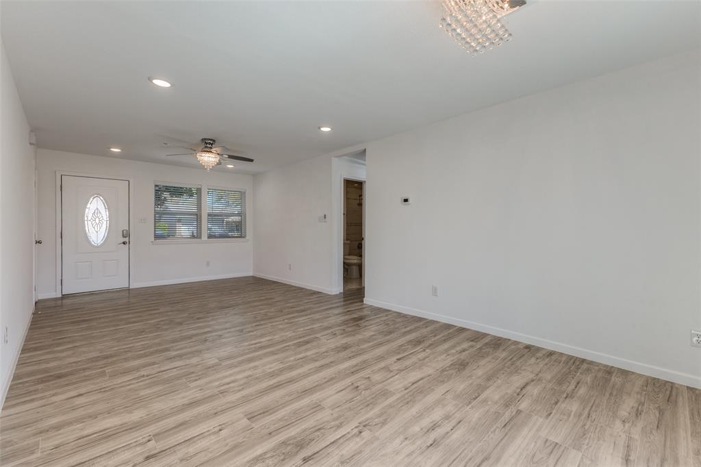 2950 Windmill Lane Farmers Branch, TX 75234 - Photo 6 of 25 a view of empty room with wooden floor