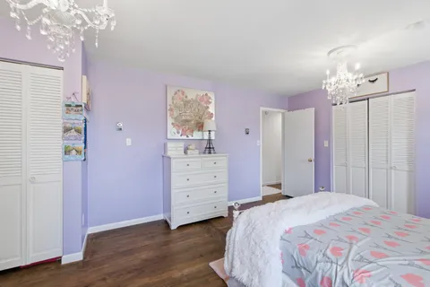 a bathroom with a sink a toilet and shower curtain