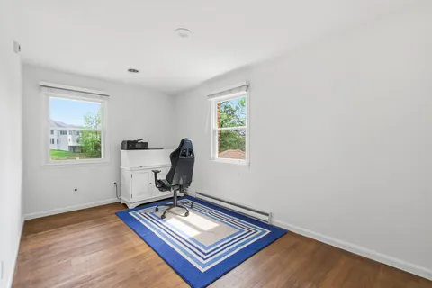 a kitchen with granite countertop stainless steel appliances sink stove top oven and microwave