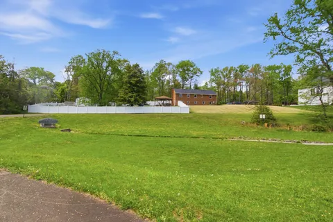a view of a golf course with a lake