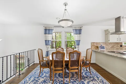 a view of a dining room with furniture window and outside view