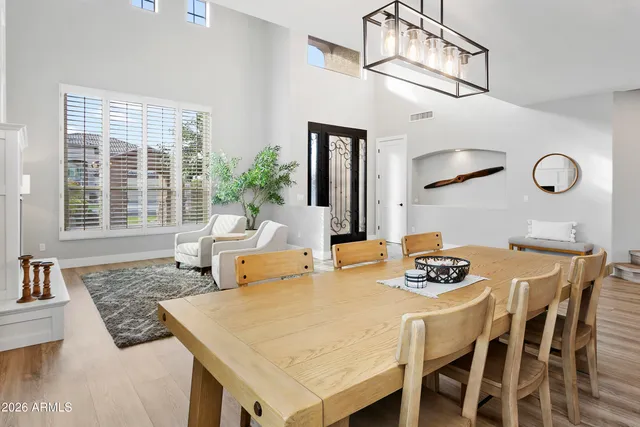 a living room with furniture ceiling fan and a flat screen tv