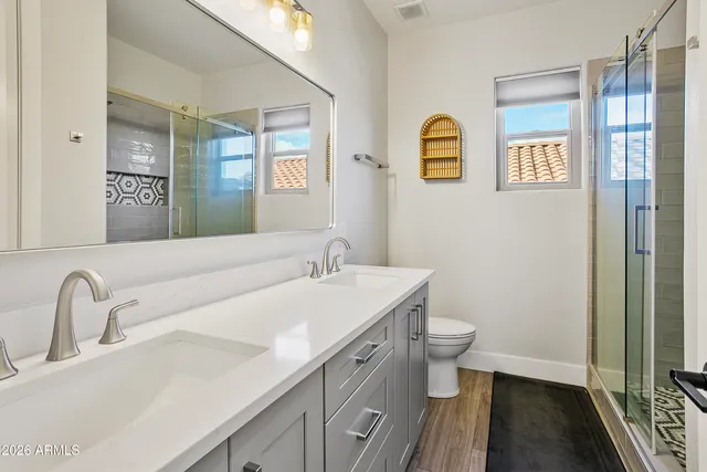 a bedroom with a bed chair and a desk in it