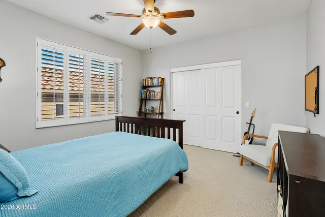 a bedroom with a bed and a fireplace