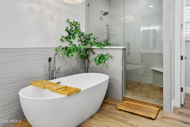 a view of walk in closet with clothes