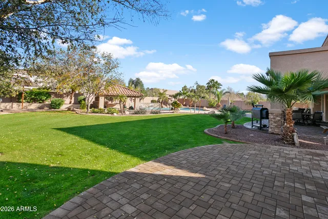 a view of backyard with a patio and outdoor seating