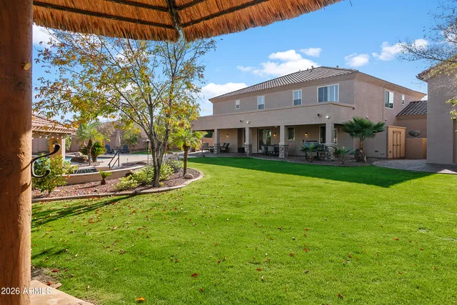 a living room with furniture a fireplace and a table