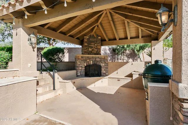 a view of backyard with seating area and barbeque oven
