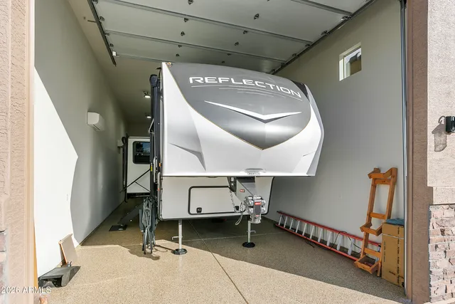 a view of a livingroom with furniture and a flat screen tv