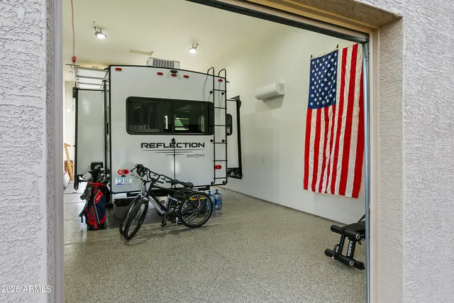 an aerial view of a house with swimming pool and outdoor seating