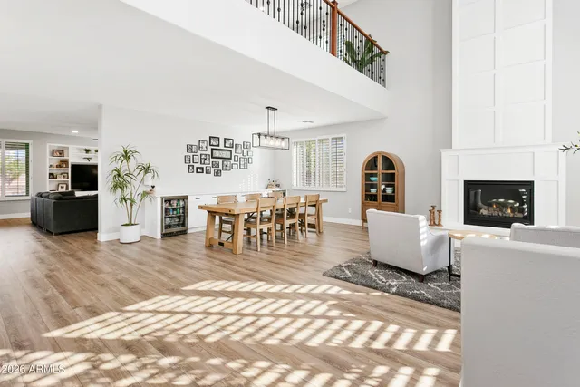 a living room with furniture a window and a fireplace