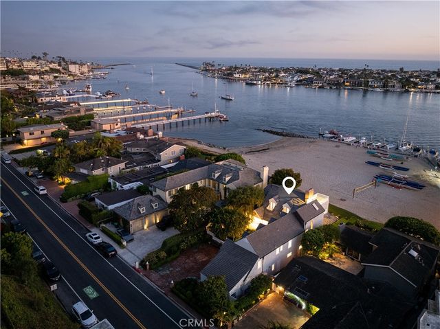 an aerial view of a house with a lake view
