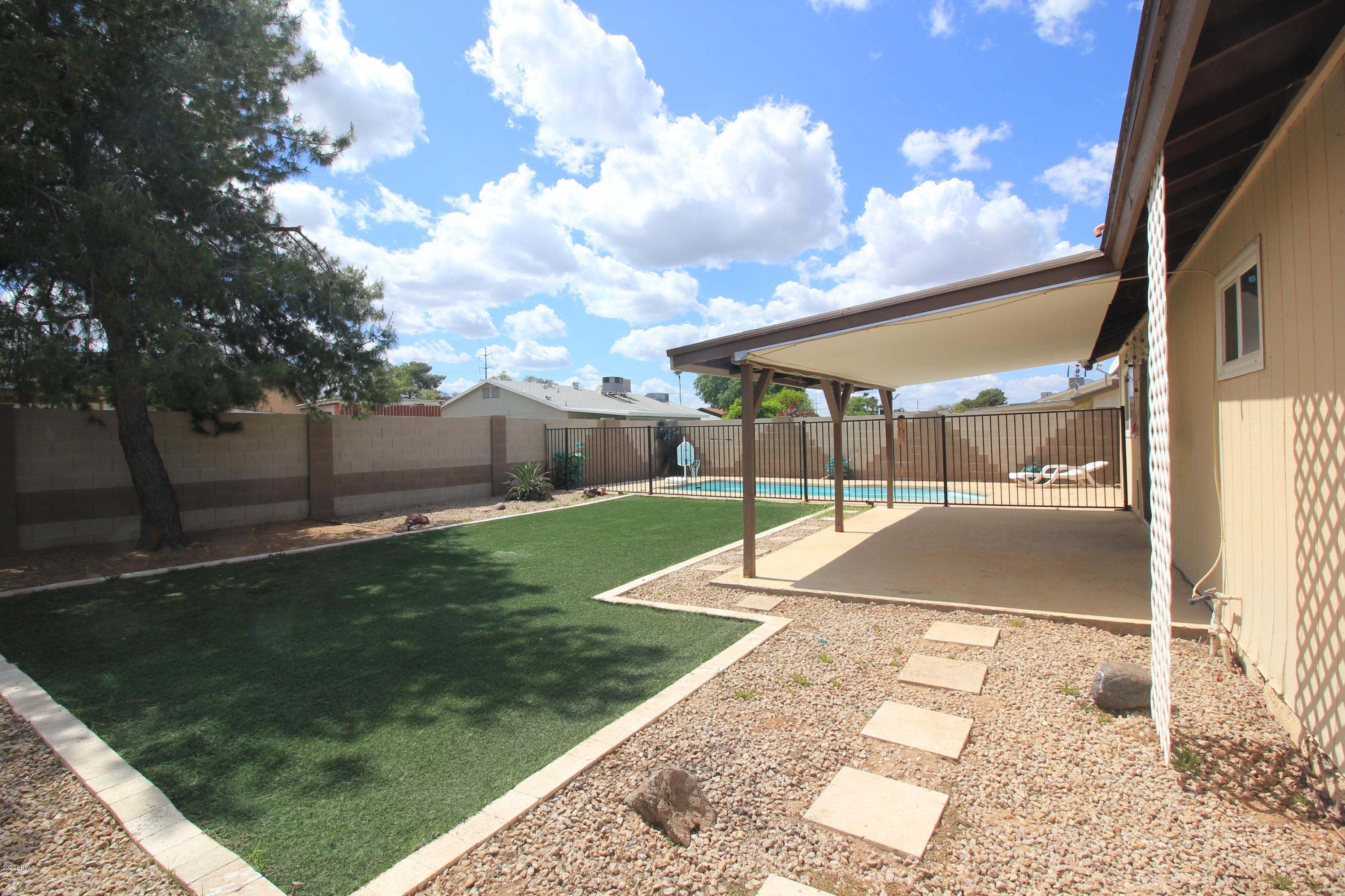 4723 East Carson Road Phoenix, AZ 85042 - Photo 8 of 23 BACKYARD LARGE ARTIFICIAL GRASSY AREA
