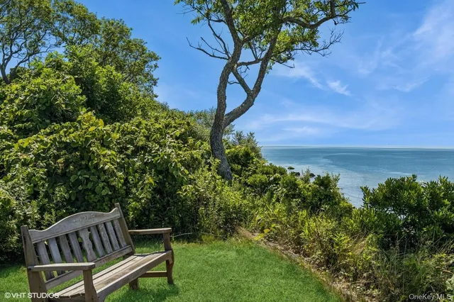 a view of a chairs in backyard of the house