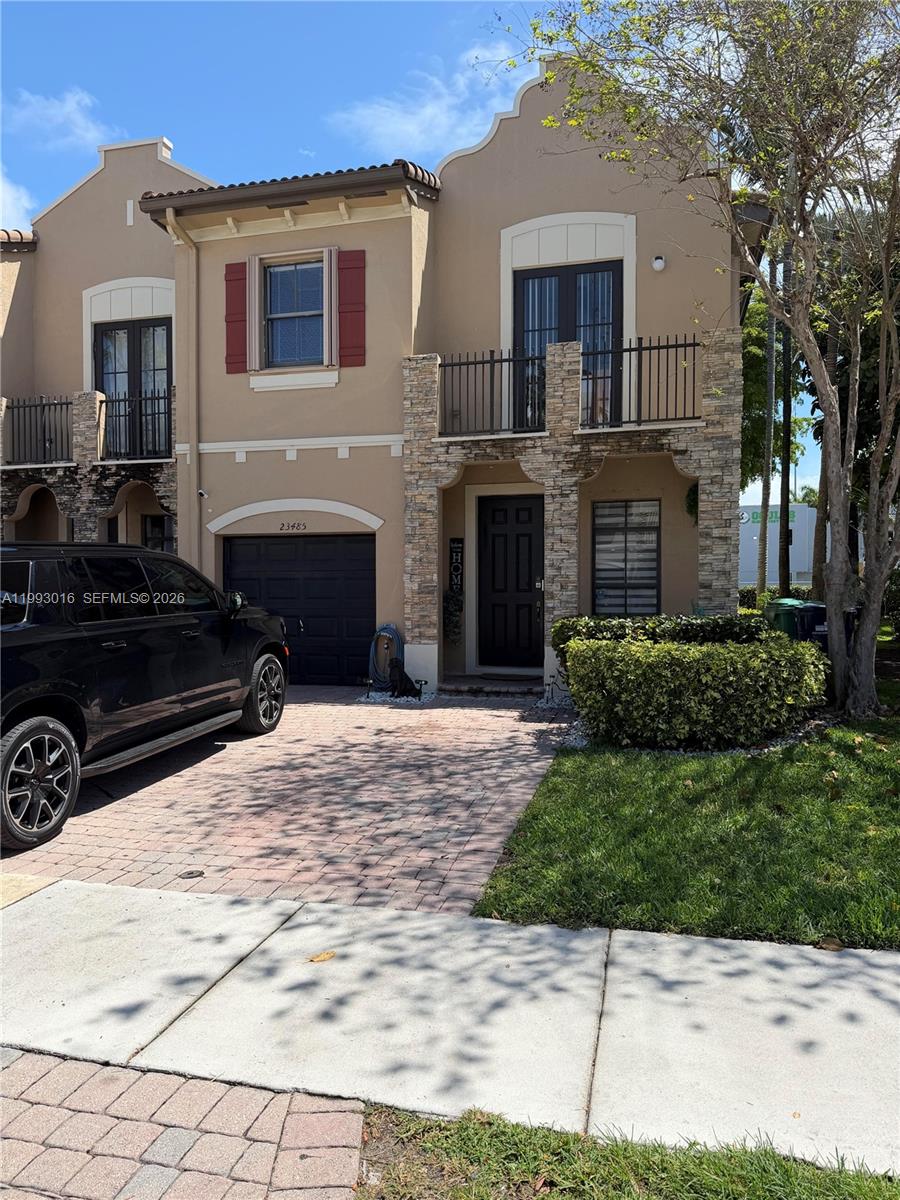 a front view of a house with a yard