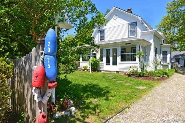 2075 Pine Neck Road Southold, NY 11971 - Photo 1 of 1 a view of a house with garden and plants