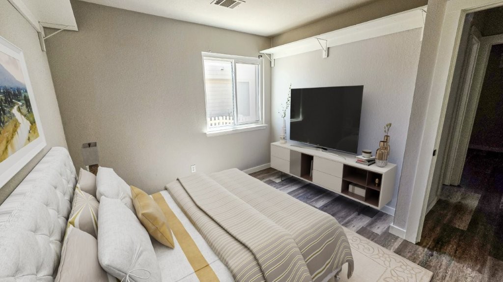 4700 Mather Kyle, TX 78640 - Photo 12 of 27 a bedroom with a bed television on desk and a window