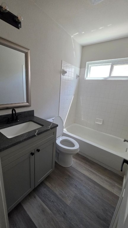 4700 Mather Kyle, TX 78640 - Photo 18 of 27 a bathroom with a granite countertop sink toilet and shower