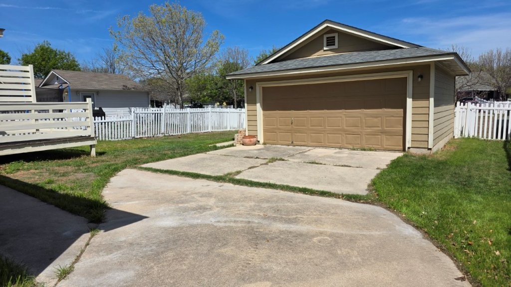 4700 Mather Kyle, TX 78640 - Photo 22 of 27 a front view of a house with a yard and garage