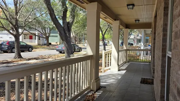 a view of a street from a balcony