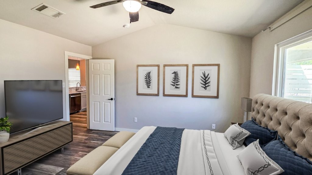 4700 Mather Kyle, TX 78640 - Photo 8 of 27 a bedroom with a bed and a flat screen tv